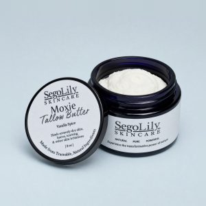 Moxie Tallow Butter, Vanilla Spice, open violet glass jar with its lid leaning against it